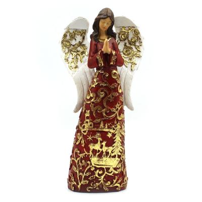 Large red and white angel praying